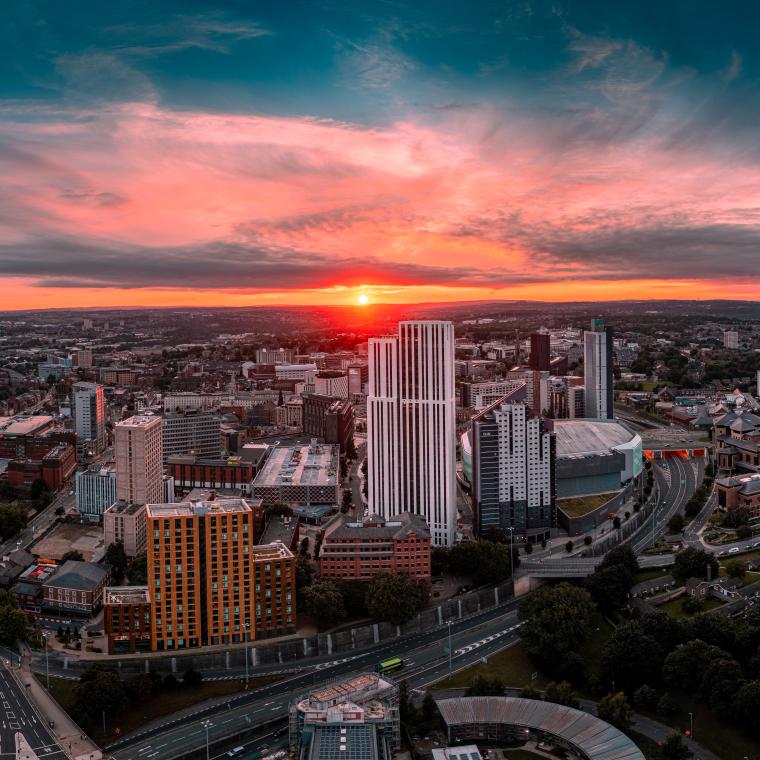 A cityscape of Leeds at dusk showing Bridgewater Place near the front of the image