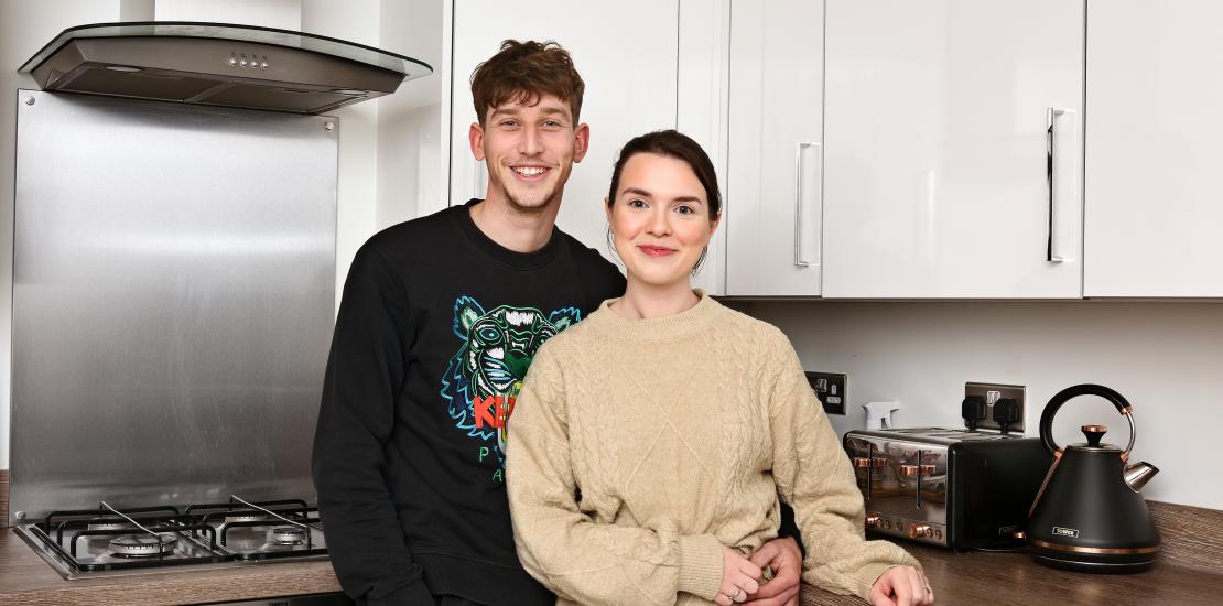 First time buyers Charlene and Kai in their kitchen